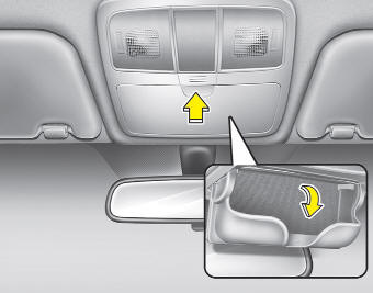 To open the sunglass holder, press the cover and the holder will slowly open.