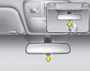 Make this adjustment before you start driving and while the day/night lever is