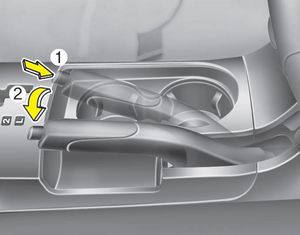 To release the parking brake, first apply the foot brake and pull the parking