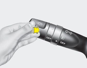 To turn on the high beam headlights, push the lever away from you. Pull it back