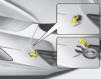 1. Open the trunk lid, and remove the towing hook from the tool case.